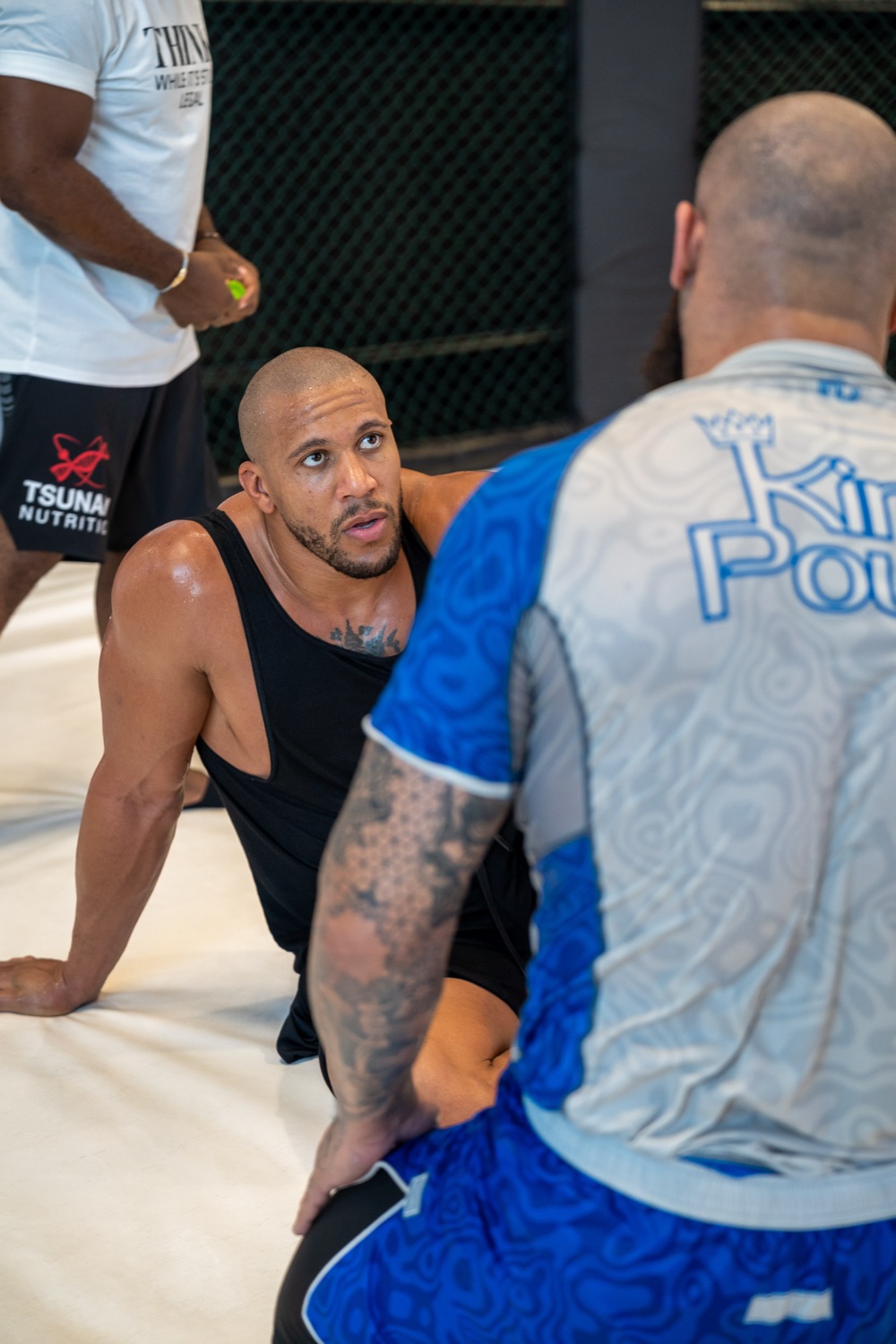MMA fighter Cyril Gane focused during a training session in the cage