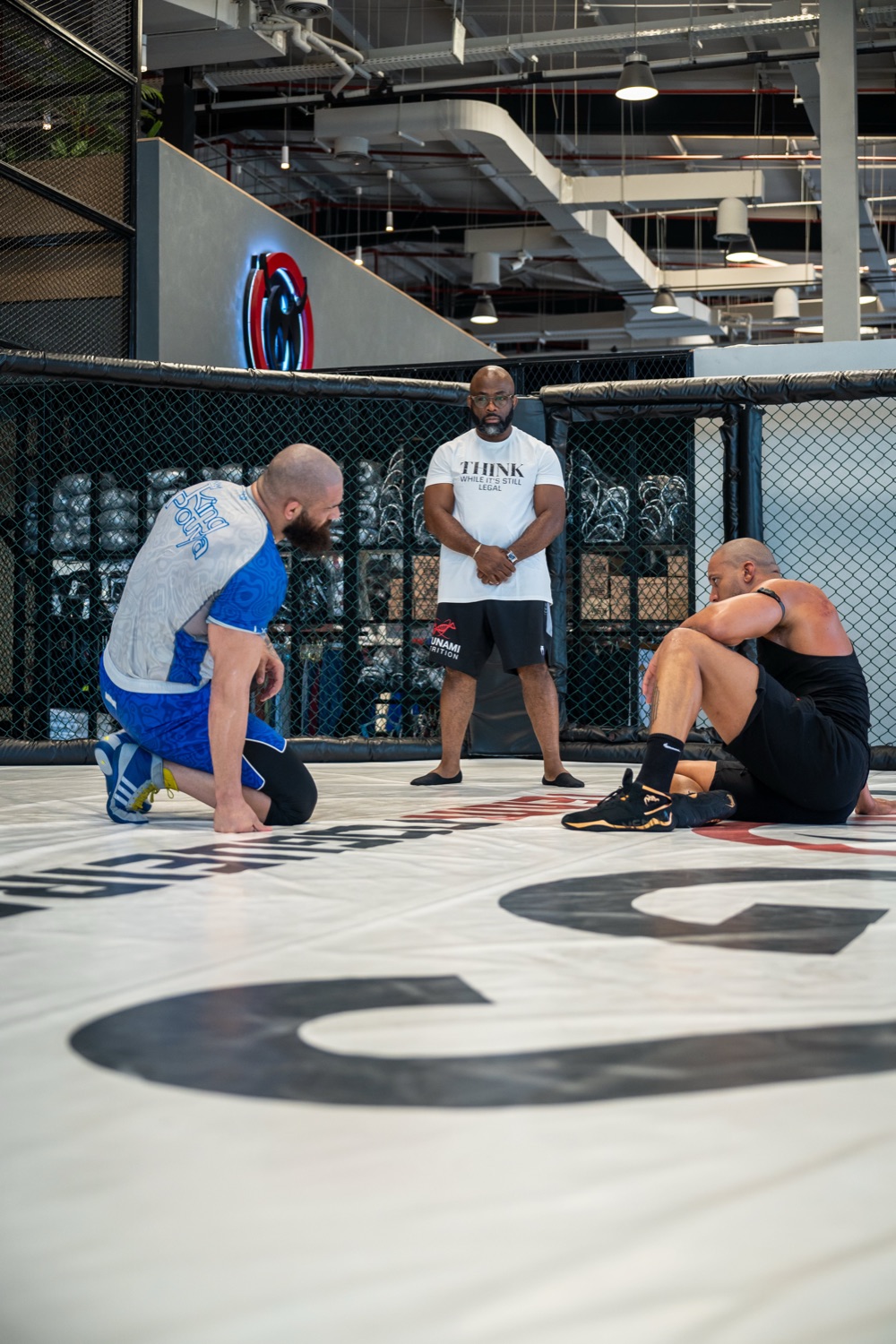 Wide shot of the cage during fight-night preparation